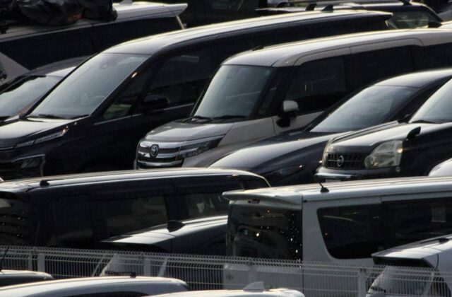 Rows of used cars on a dealership lot where resale value is set