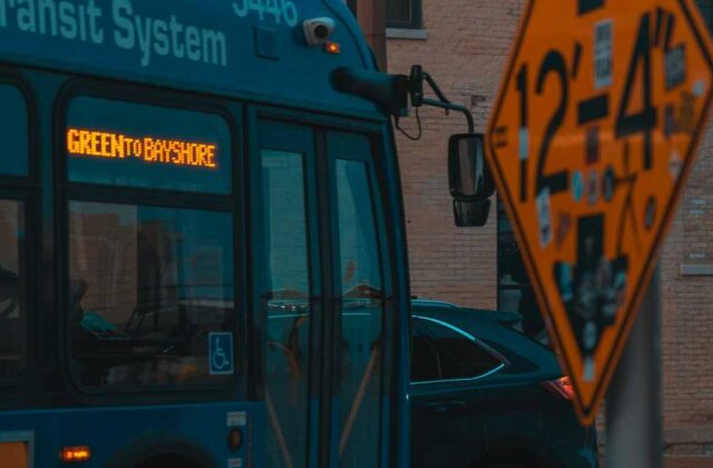 A Metro bus stopped at a San Fernando Valley intersection in the evening