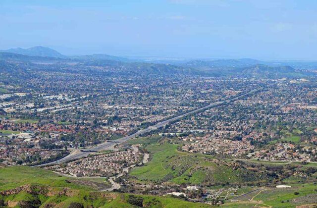 Wide suburban boulevard in Simi Valley with the Santa Susana Mountains in the background
