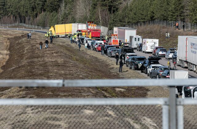 Traffic backed up bumper to bumper along a multi-lane road